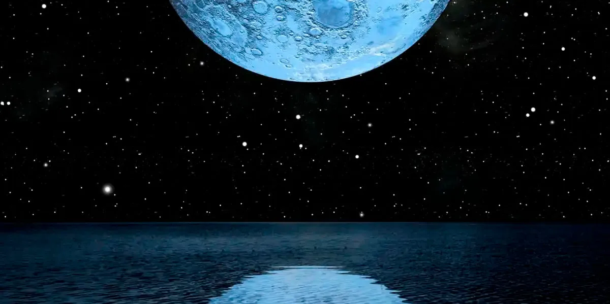 A Blue Moon Rising Over A Calm Ocean Wall Art