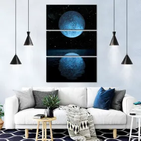 A Blue Moon Rising Over A Calm Ocean Wall Art