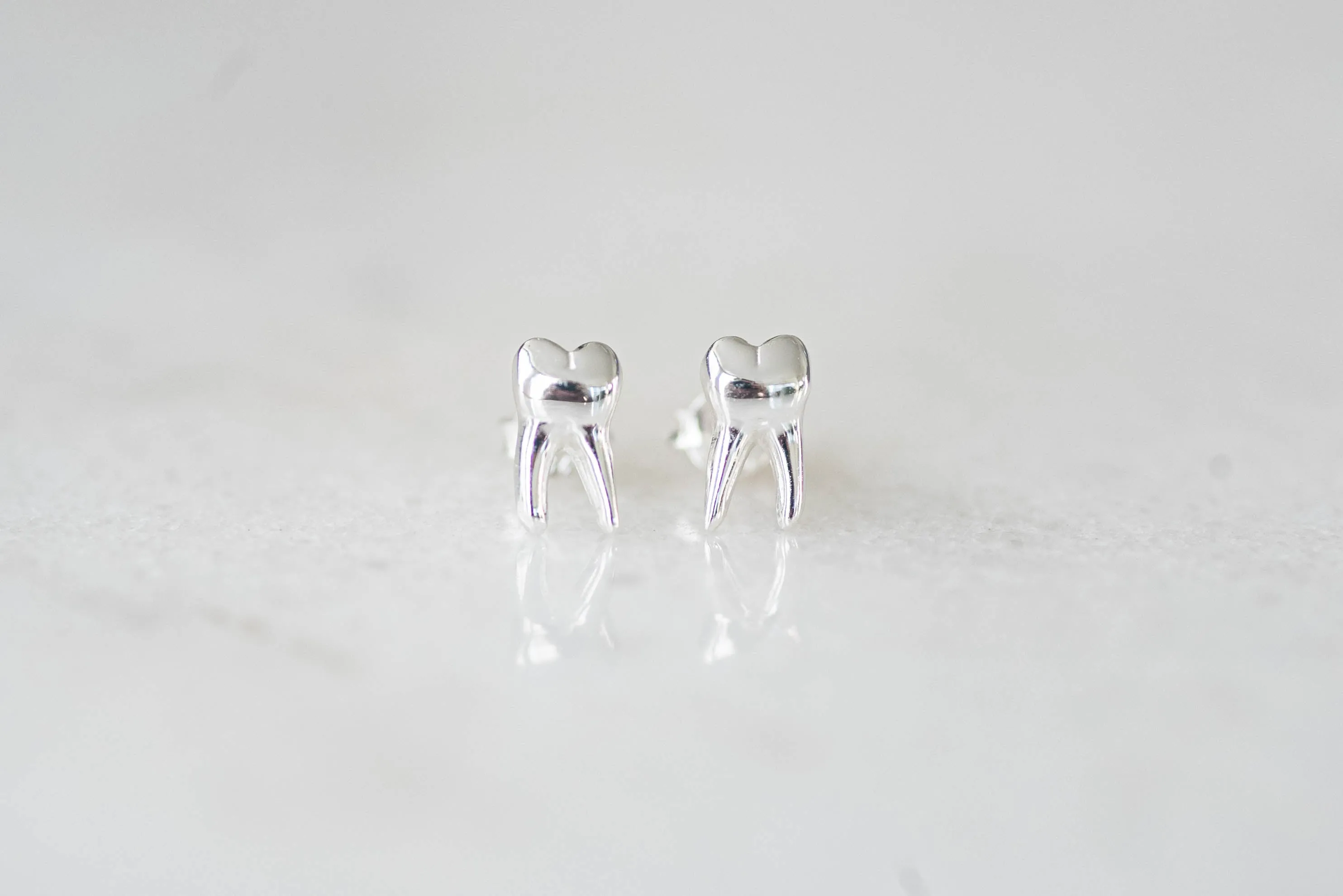 Tooth stud earrings